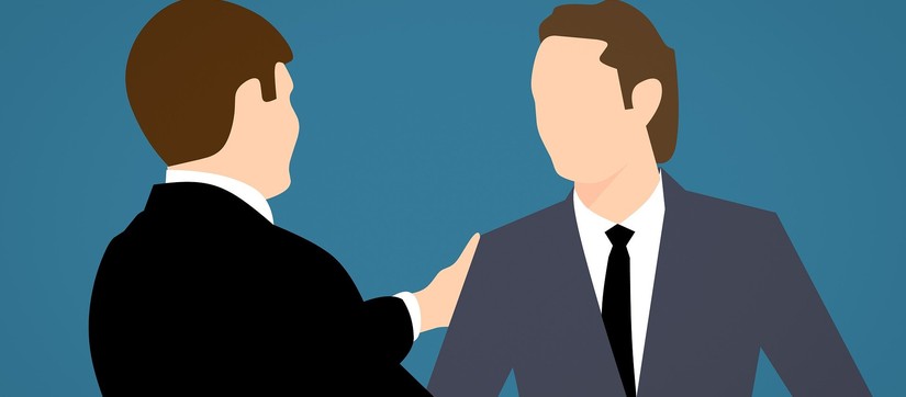 Eine Illustration zeigt zwei Männer im Anzug, die sich die Hände schütteln